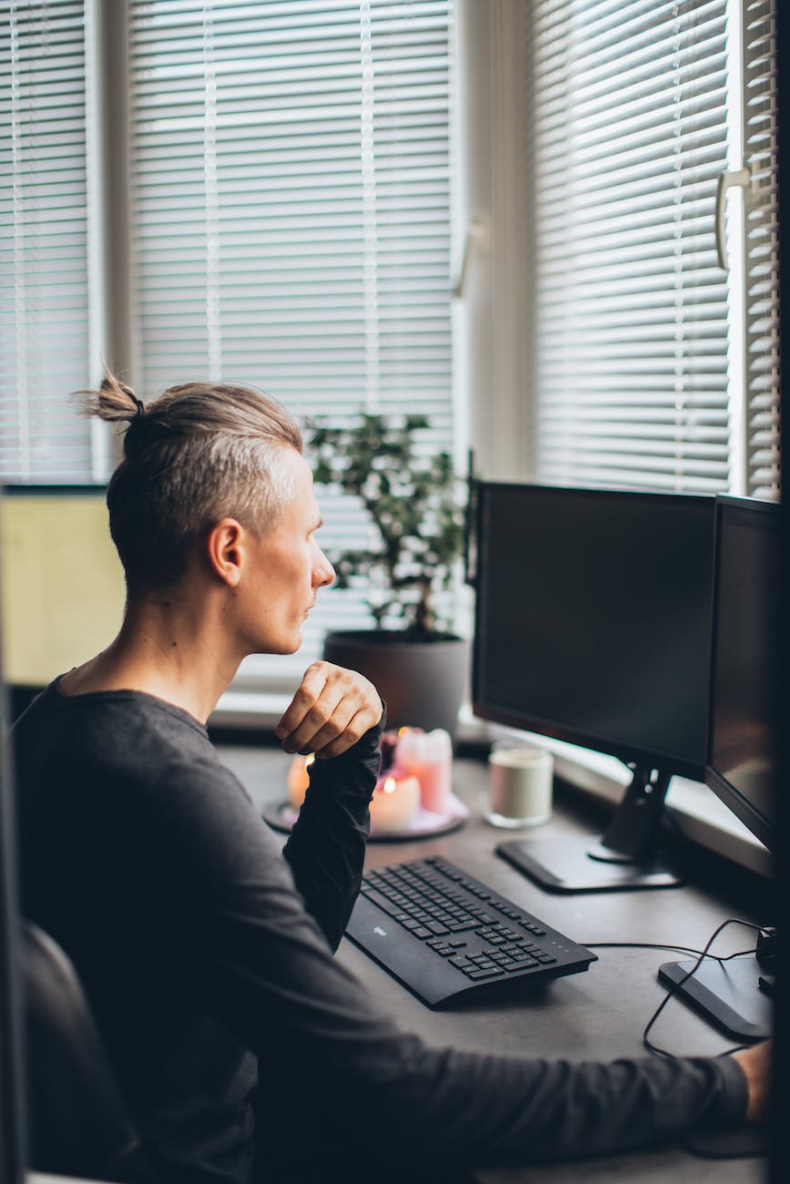 man in front of his computer